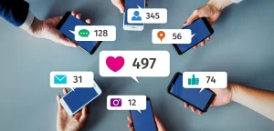 This image is about people hand showing Engagement with likes, comment and share etc.